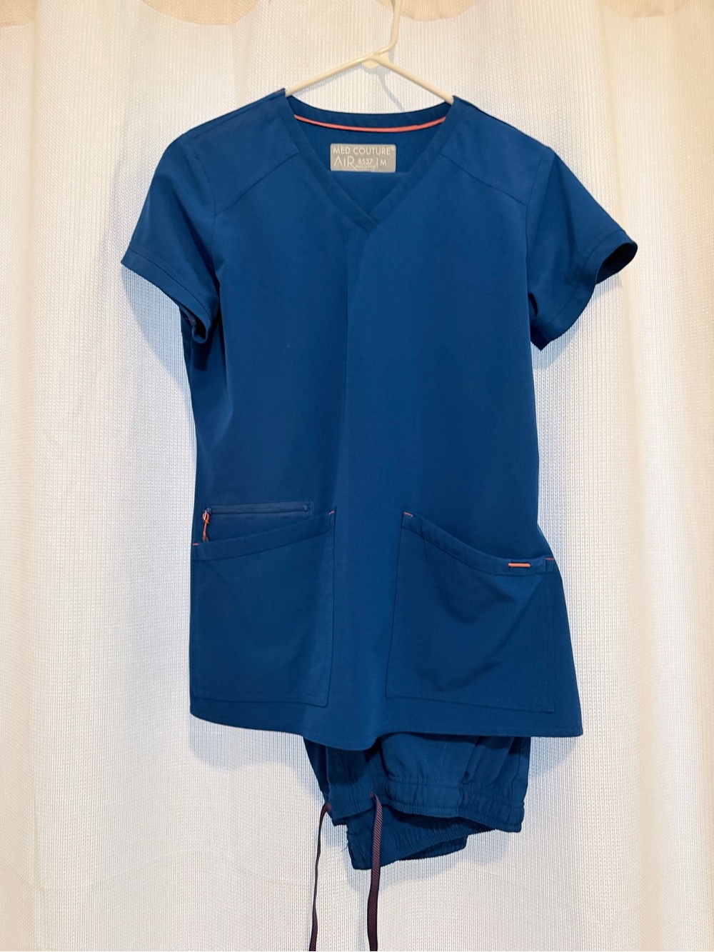 Med Couture AIR V-Neck Scrub Top in Navy with Coral Trim
